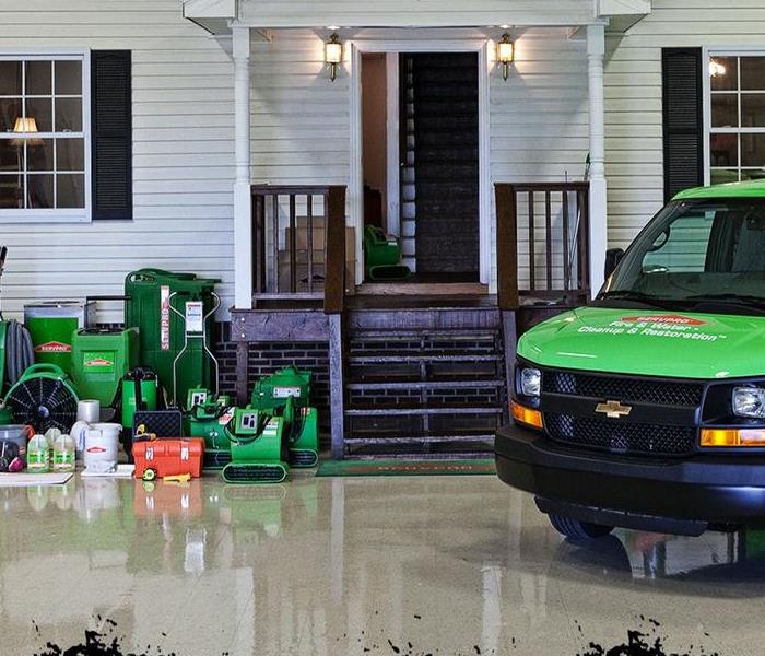 SERVPRO workers with orange logo